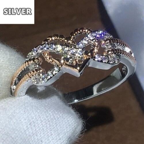 The new creative fashion decorative pattern that connect a flower to love heart-shaped ring 18 k gold plated color ring