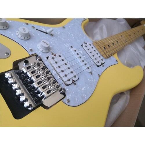 Free shipping custom left hand yellow guitar,HSH pickups,tremolo bridge,maple neck ,chrome buttons,pearl shell pickguard
