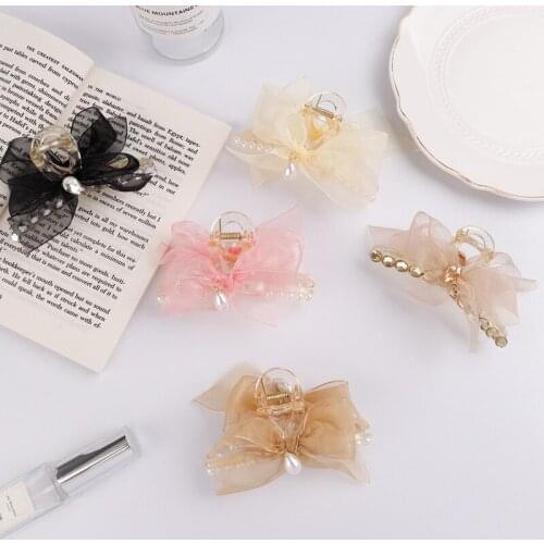The new net yarn bowknot pearl pendant diamond hair accessories headdress grasping clip hairpin back head disc hair shark clip