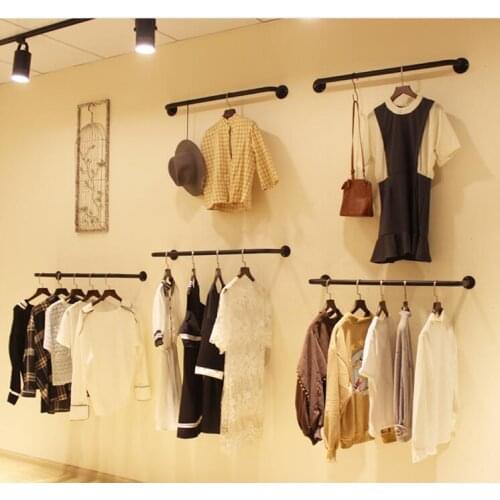 A display rack for an iron clothing store. A wall hanger for womens wear. The u-shape is hanging on the side..1106