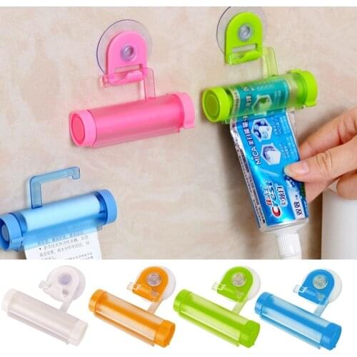 1Pc 5 color Easy Squeezer Toothpaste Roller Tube Rack Dispenser Rolling Holder Easy Squeeze Paste Dispenser Roll Holder Hanging