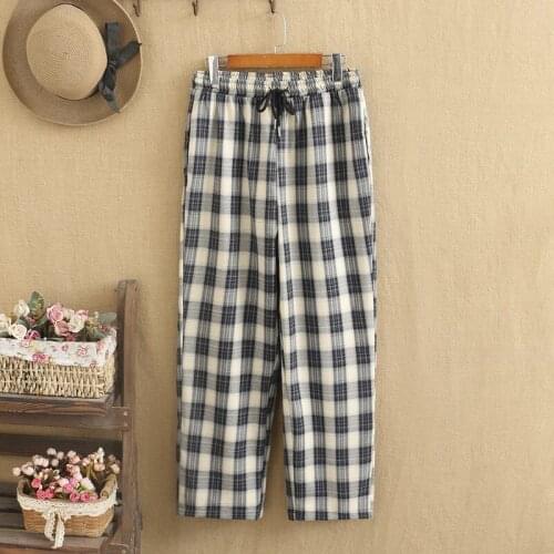 Women plus sizes Cotton trousers with an elastic waist Trousers with a plaid pattern and pockets on each side Large size Women