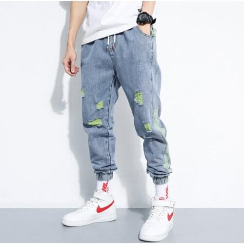 Casual loose holes stitching elastic tight feet increased Harlan denim cropped trousers mens jeans