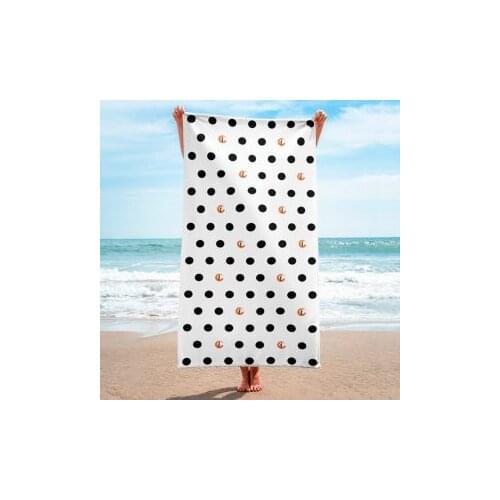 Polka dot beach towel and logo