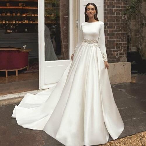 2020 Bohemian Bride Dresses Bateau Neck Applied Pearls White Satin Wedding Dress With Long Sleeves Backless Robe De Mariee