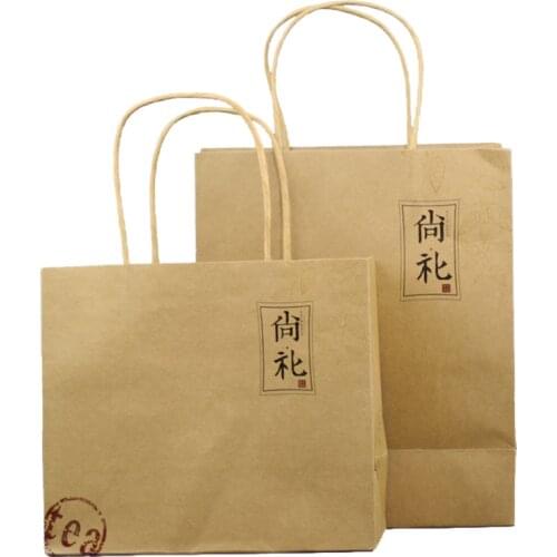 Xin Jia Yi Packaging Kraft Paper Bags Brown Color Square Bag With Paper Handles Hot Sale Shopping Bag Supplier in China