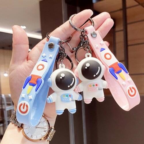 Cute astronaut keychain women men rubber pendant keyring fashion space rocket spaceman keyfob trinket bag pendant for car keys