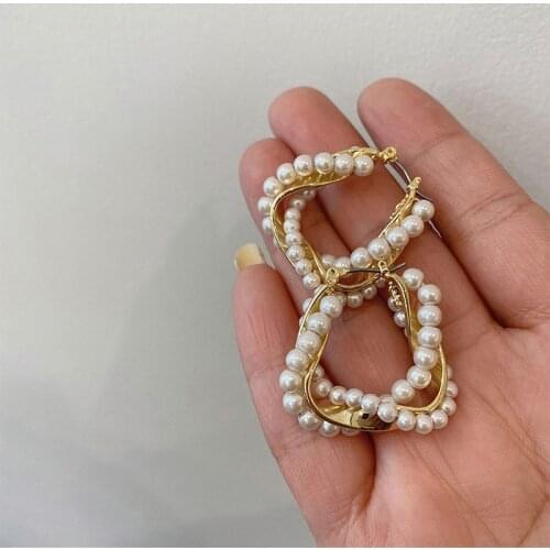 Statement Distortion Metal Pearl Huggie Knotted Hoop Earrings for Women French Vintage Beaded Hollow Out earrings Instajewelry