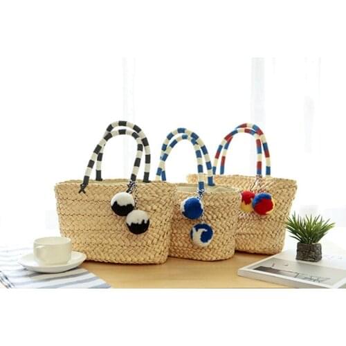 European and American style new color matching cute wool ball straw bag hand bag shoulder bag handmade grass woven beach bag