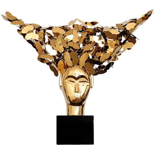 The modern model room is decorated with European retro figures and soft metal sculptures on the desktop of the living room porch