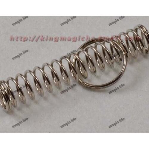 Spring and Ring Spring magic locked in the spring of the steel ring to free shuttle close up magic magic props 20pcs each lot