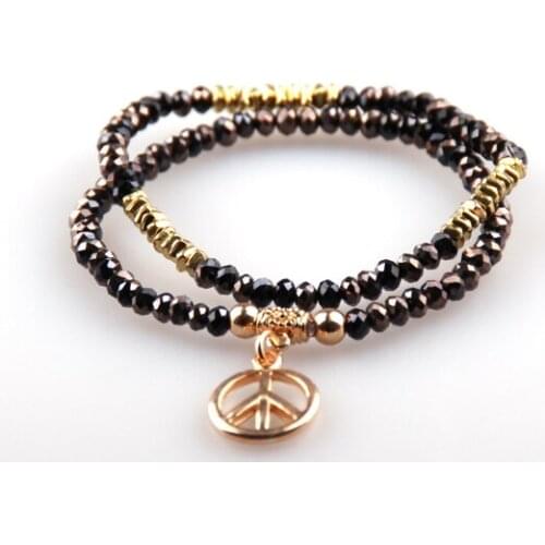 FREE DROP SHIPPING 2015 HOT SELLING 2PCS NEW SPARKLING BLACK GLASS AND GOLD PRINTED ALLOY PEACE PENDANT BEADS BRACELET SET