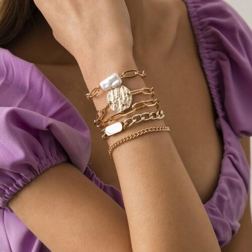 Hot-selling jewelry with punk style metal hollow claw chain bracelet set temperament profiled imitation pearl bracelet for women