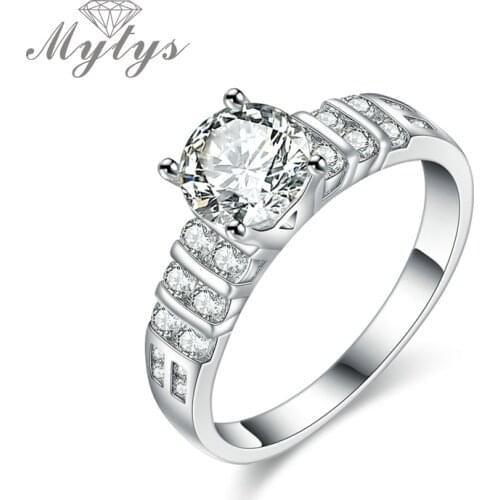 Mytys High Level Prong Setting Cubic Zircon Engagement Ring Weeding Bangs for Women Silver Color Classic Jewelry Gift R1200