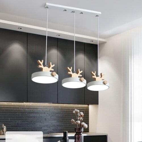 Nordic creative solid wood deer head LED chandelier restaurant chandelier living room bedroom chandelier hotel room LED bulb