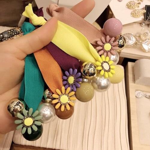 Europe and the United States sweet and lovely color sun flower acrylic imitation pearl widening hair ring accessories wholesale
