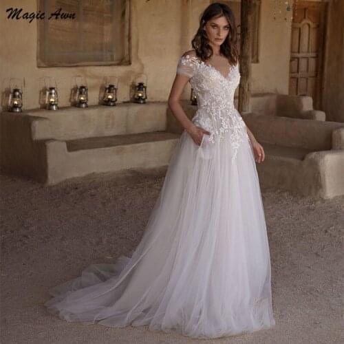 Magic Awn Bohemian Wedding Dresses Lace Appliques Illusion Short Sleeves Princess Beach A-Line Bridal Gowns With Pockets Vestido