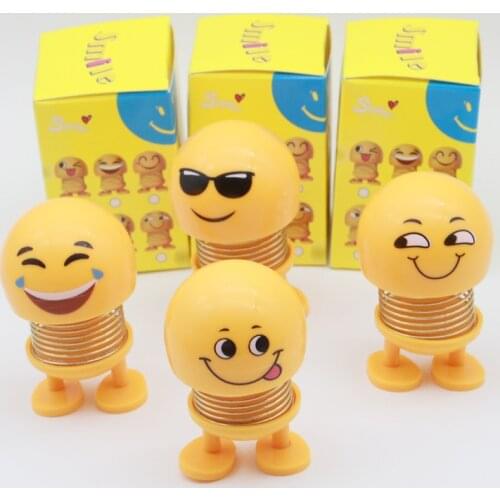 Small yellow car ornaments car shaking doll spring car ornaments car decoration accessories