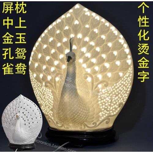Peacock white porcelain lamp hollow lamp bedside lamp light in the bedroom modern pastoral real wedding wedding engagement