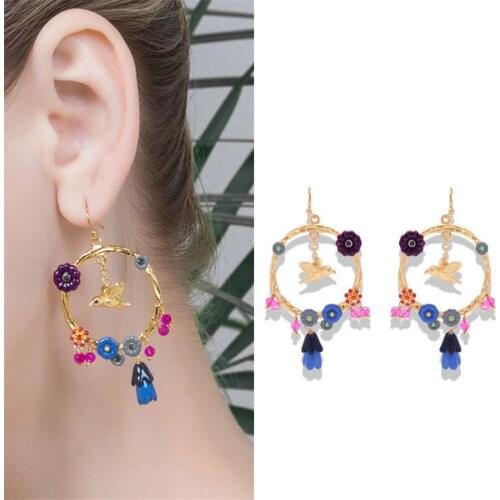 European and American temperament handmade enamel lily of the valley bird pendant earrings fashion circle niche ear hooks