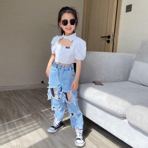 Summer fashion boys and girls new style ripped solid color printed letter jeans European and American style foreign trade childr