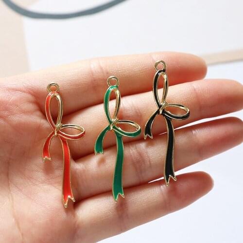Free Shipping 40pcs 16*43mm Hollow Out Ribbon Knot Bow Alloy Necklace Pendant Gold Tone Enamel Metal Jewelry Earring Charms