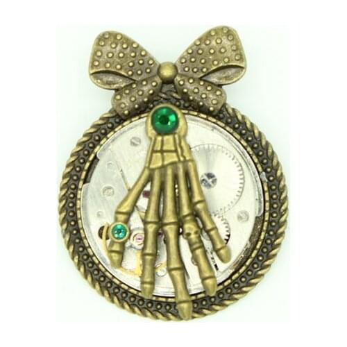 Steampunk Jewelry Skeleton Hands Brooch Pin with Antiqued Brass Bowtie Setting Vintage watch movement Brooches