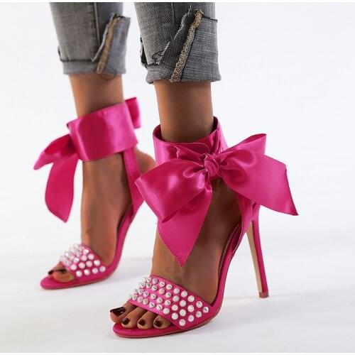Spring and summer new European and American bowknot rivet sandal women plus-size open toe stiletto heel womens shoes dinner