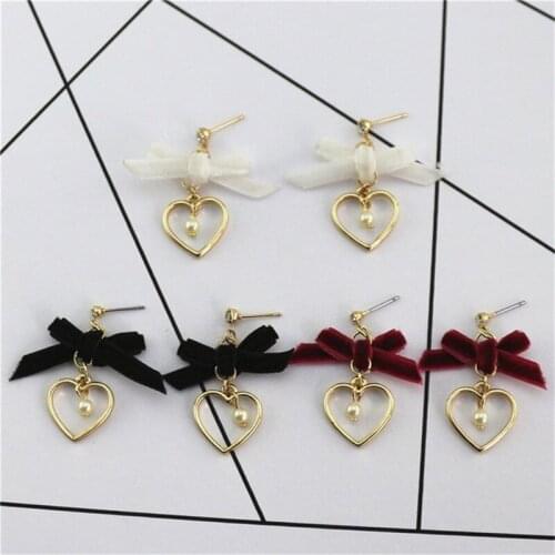 New European and American bow single-faced flannel imitation pearl heart-shaped fashion personality beautiful earrings