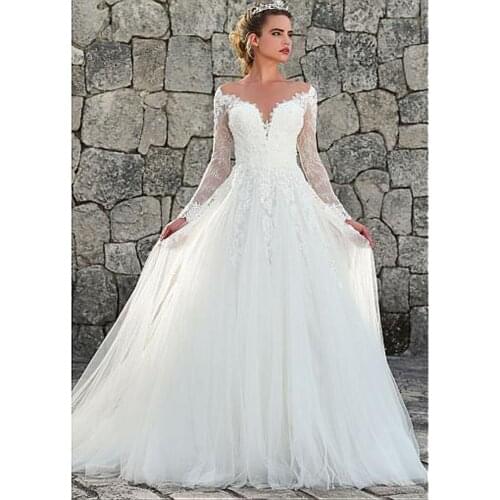 Marvelous A-Line Wedding Dresses Long Sleeve Lace Appliques Sexy Backless V-Neck Elegant Boho Illusion Beach Bridal Dresses 2021