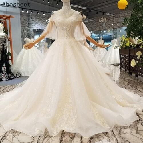 2021 Off Shoulder Ball Gown Wedding Dress Flare Sleeve Light Champange Beading Wedding Gown Long Train Embroidery Lace Bridal