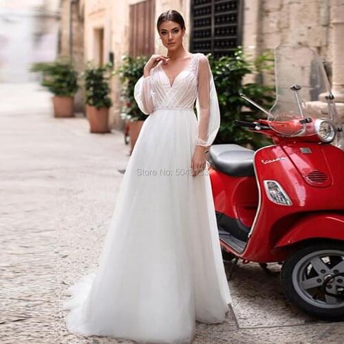 Fascinating A Line Tulle Wedding Dresses 2020 Sexy V Neck Long Sleeves Boho Wedding Gowns Beaded Floor Length Beach Bride Dress