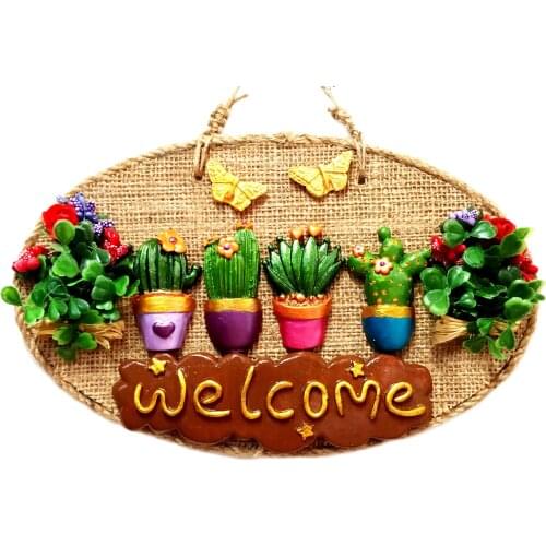 Door and Wall Decor Decorated With Flowers Written 'Welcome