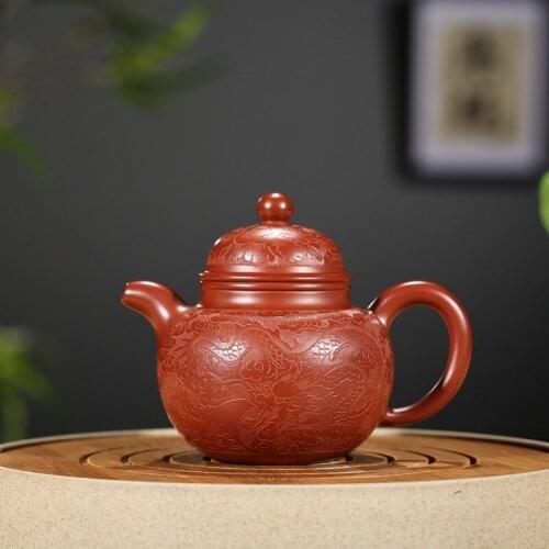 Yixing recommended dahongpao hand carved dragon Duo ball pot famous recommended a undertakes to wechat business agent