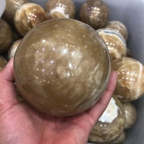 The mineral crystal ball of 10 centimeters of natural yellow decorates aquarium