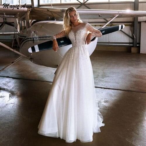 Magic Awn Sparkly Boho Wedding Dresses Pearl Beaded Long Sleeves Illusion Princess Beach A-Line Wedding Party Dress For Bridal