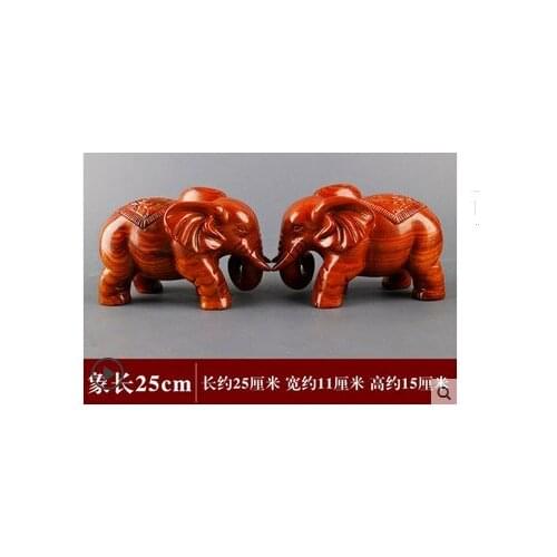 A pair of wooden elephants are arranged Chrysanthemum pear decoration Carving handicraft statue black sandalwood rafts dies