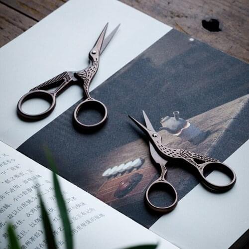 Retro crane-shaped scissors, tea bags, tea leaves, Japanese tea, tea ceremony, and hand-cut kitchen scissors