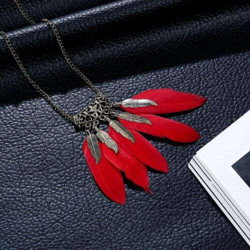Hot sale Bohemian retro hollow personality feather necklace ethnic style Women pendant red black long chain sweater chain jewelr