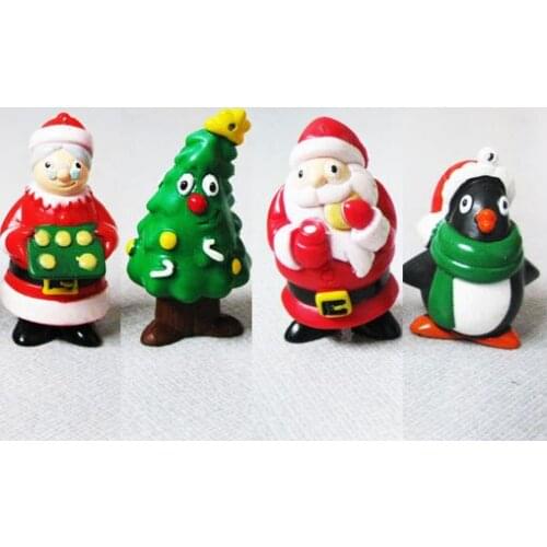 A decorated Christmas tree Christmas gift Santa Claus dolls Santa Claus penguin hang Christmas ornament