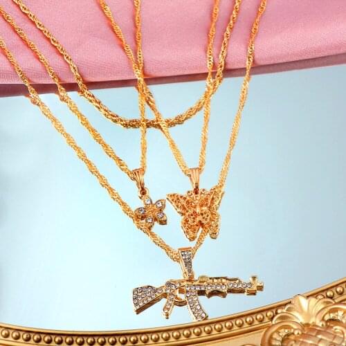 JUST FEEL Fashion Multi Layer Butterfly Pendants Necklaces For Women Crystal Golden Metal AK47 Gun Necklace New Design Jewelry