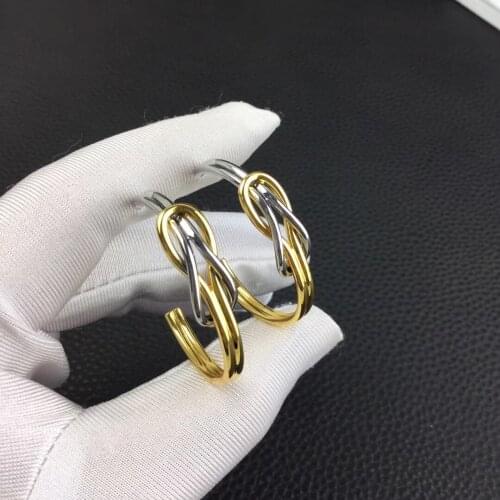 The cold wind in Europe and the United States knotted gold and silver ring earrings