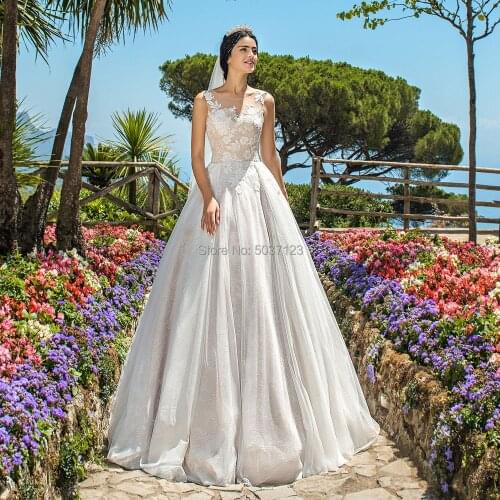 2020 Romantic A Line Wedding Dresses Sleeveless Scoop Lace Appliques Button Illusion Vestido De Noiva Court Train Bridal Gown