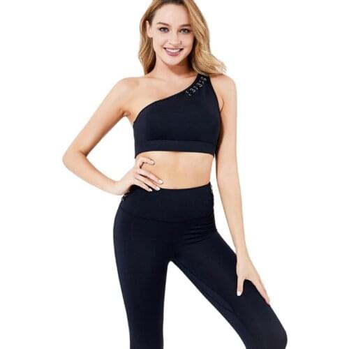 New sexy slanted shoulders, high waist and hip lifting pants, hollow bra sportswear and yoga suit with pocket women