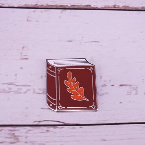 Fall into Books hard enamel pin chocolate brown autumn leaves book pin literary gift