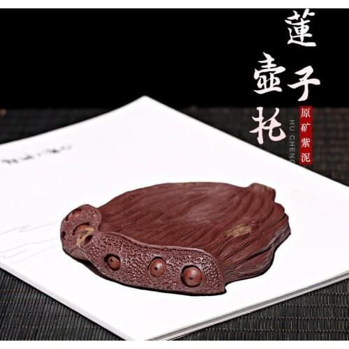 Zisha pot is made of raw ore and purple mud. Its made by hand. Its a gift tea set customized by the manufacturer