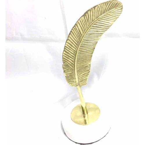 Beautiful modern creative brass feather home decoration with white marble base