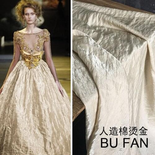 High-grade bronzed fabrics artificial cotton shiny pearl turquoise fabric crease texture gentle drooping dress designer fabrics
