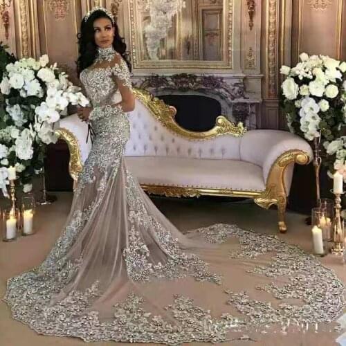 Arabic 2020 Luxury Wedding Dresses Sheer Long Sleeves High Neck Lace Applique Beaded Mermaid Bridal Gowns Chapel Train Dubai