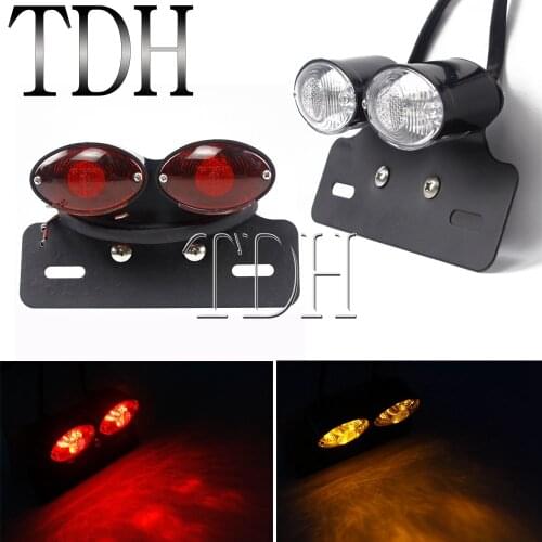 Universal Motorcycle Dual Cat Eye Taillight LED Rear Brake Turn Signal Light Motorbike License Plate Holder Bracket For Harley